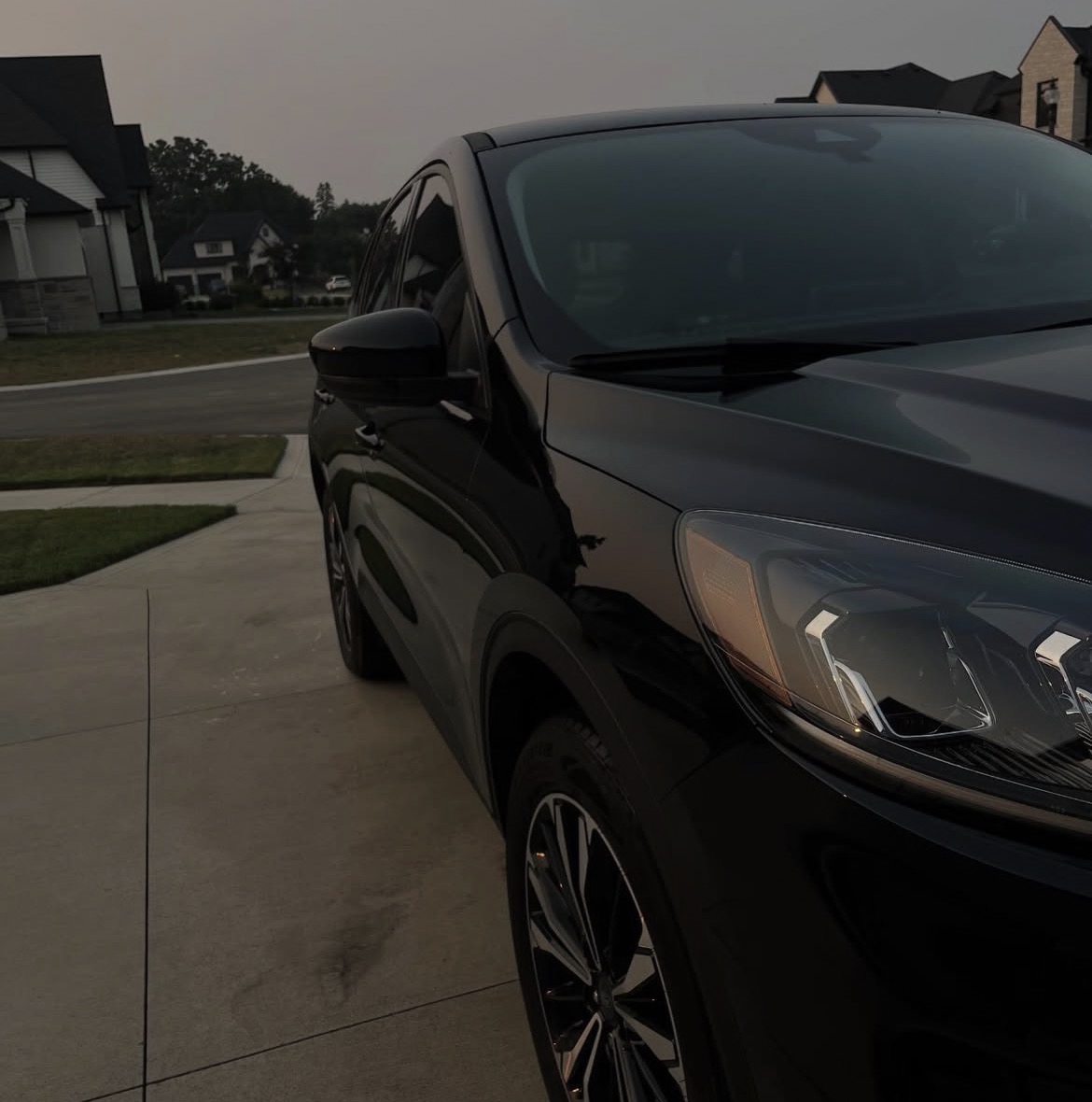 Freshly detailed black SUV at dusk in London, Ontario